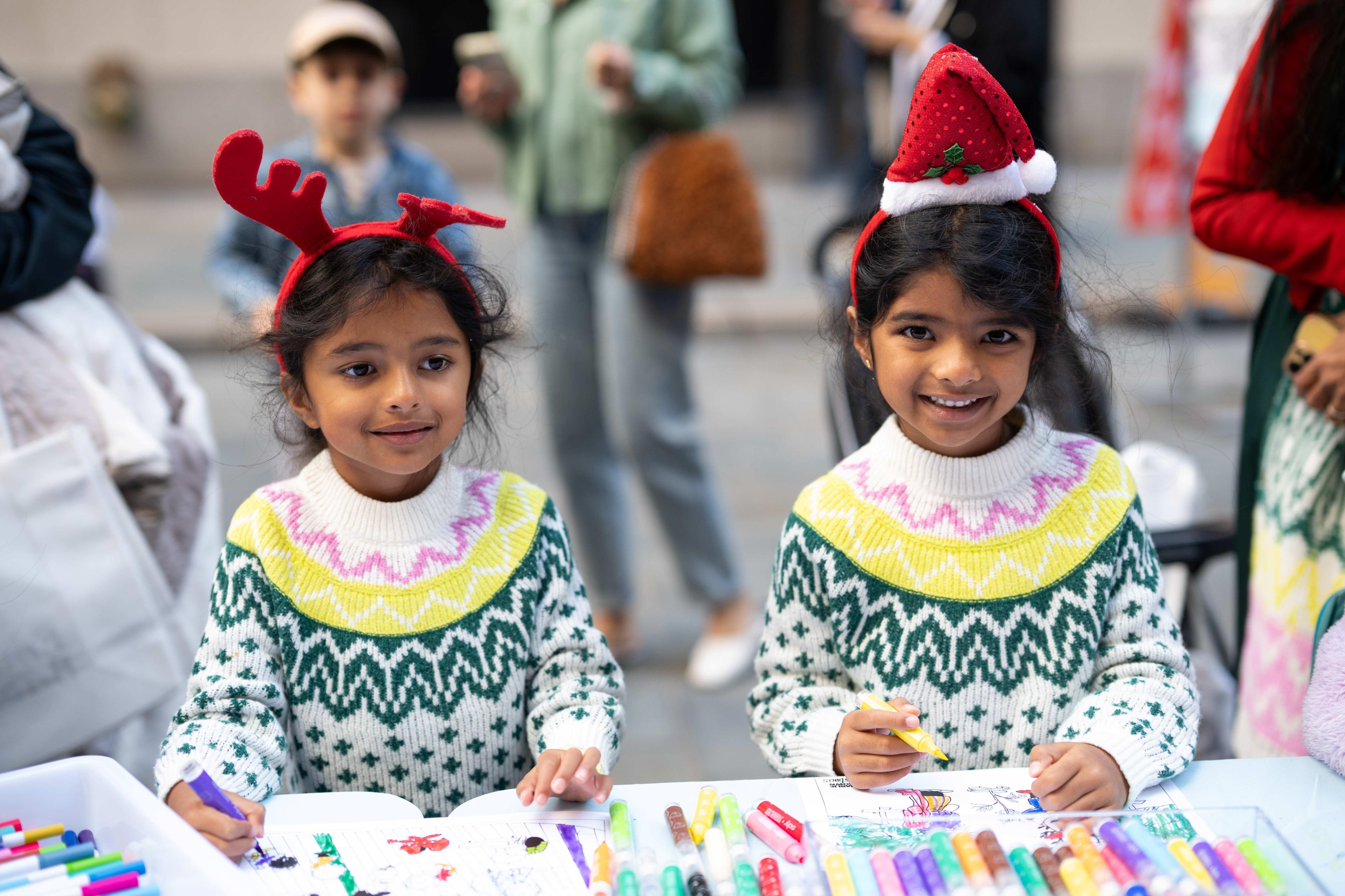 two girls doing a christmas craft
