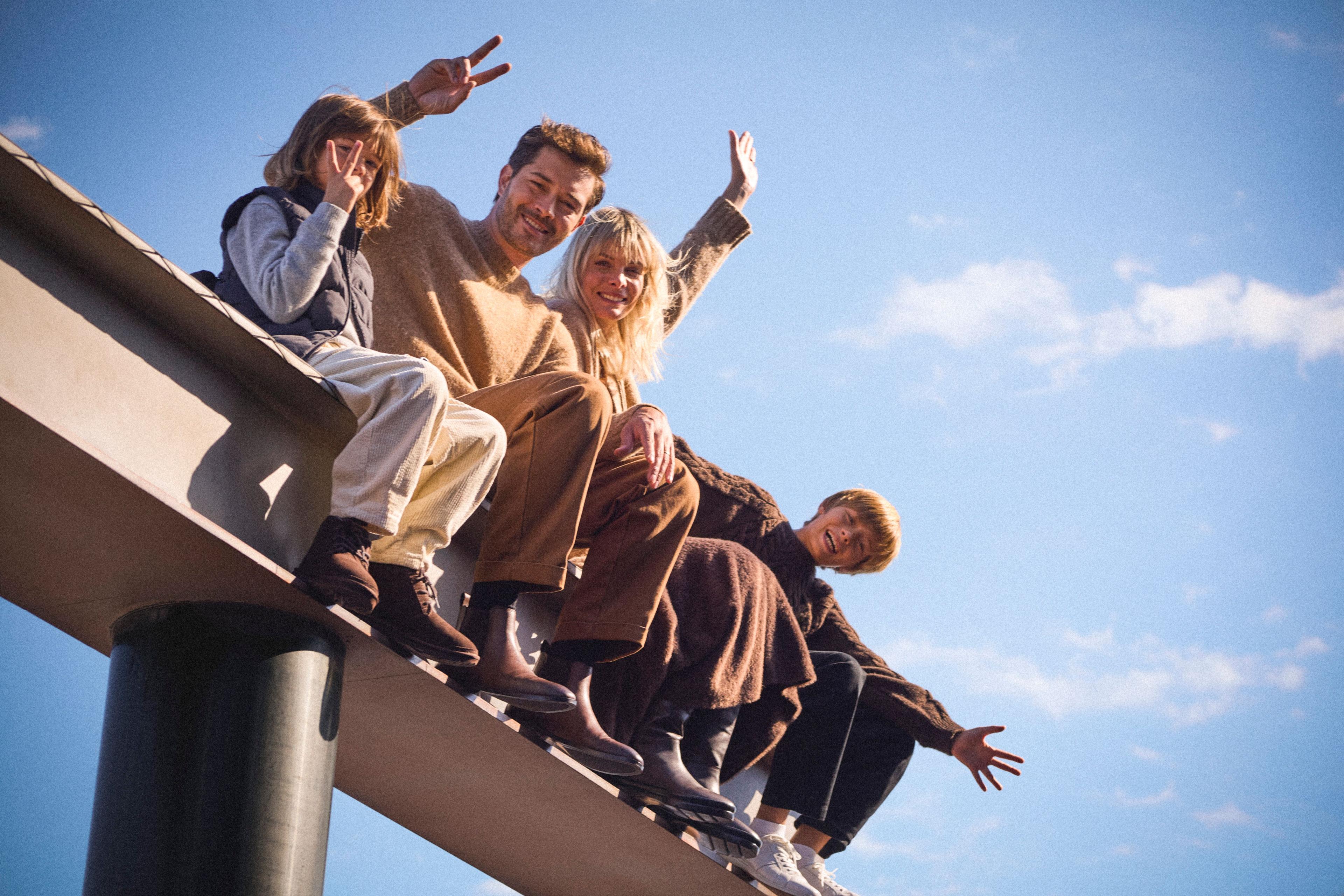 a family on the beam experience at top of the rock