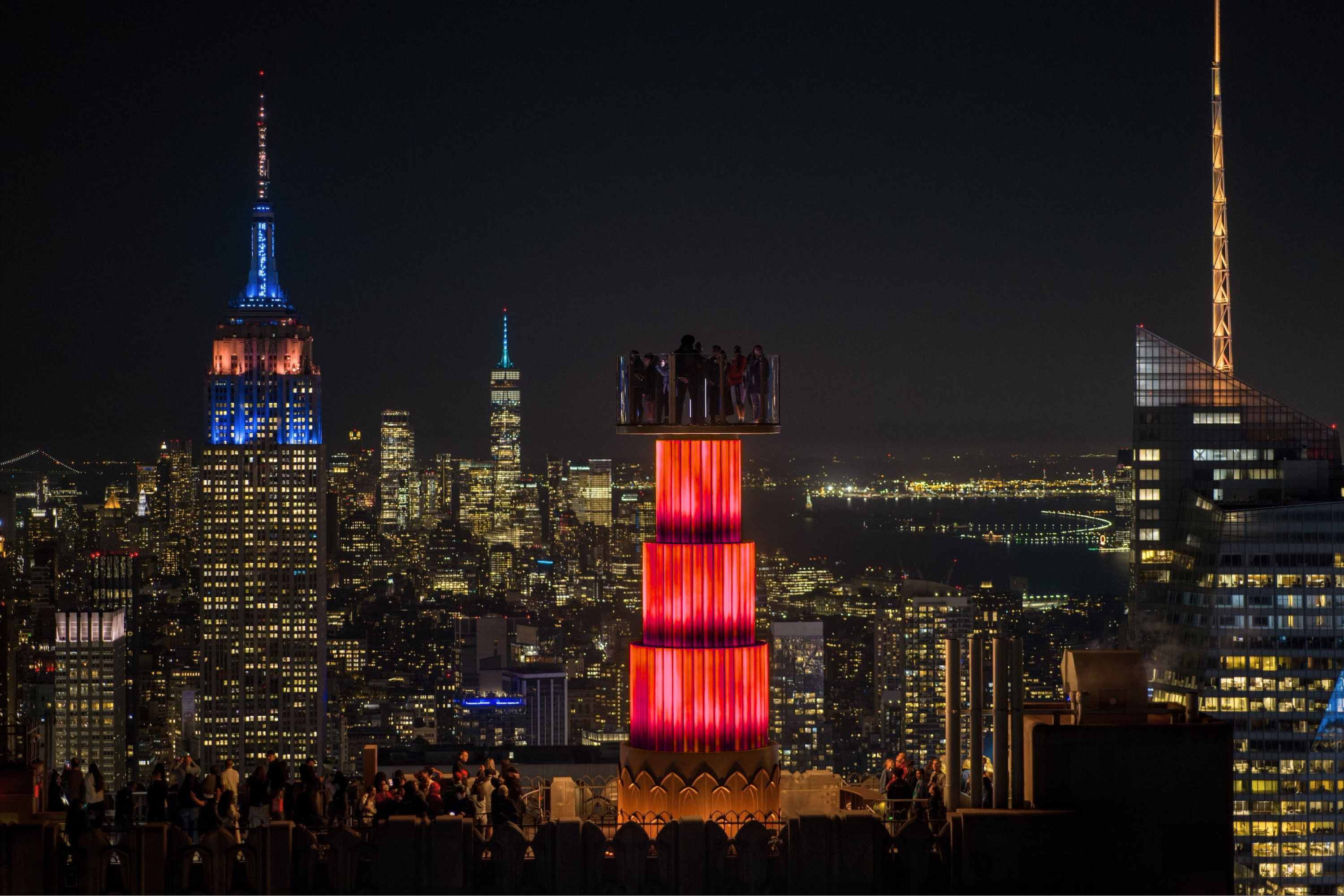 skylift at top of the rock lit up red