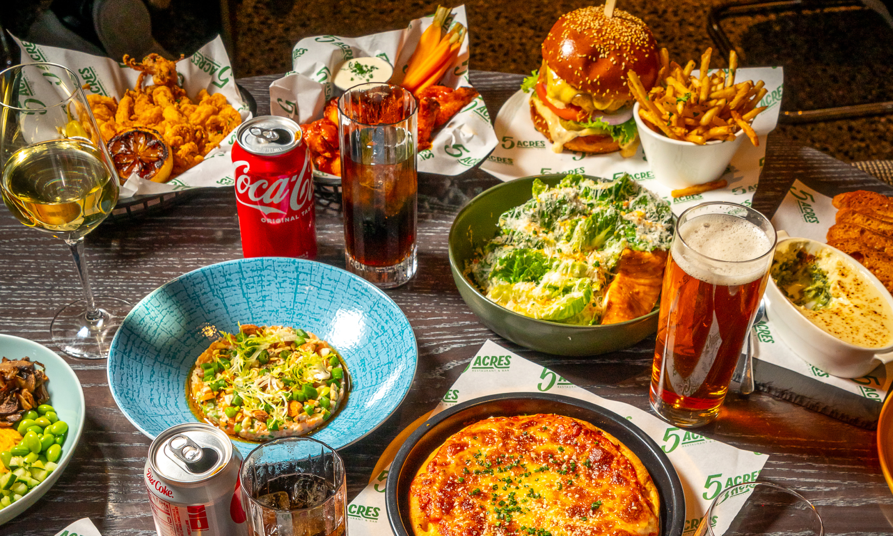 Plates of food on a table at 5 Acres at Rockefeller Center