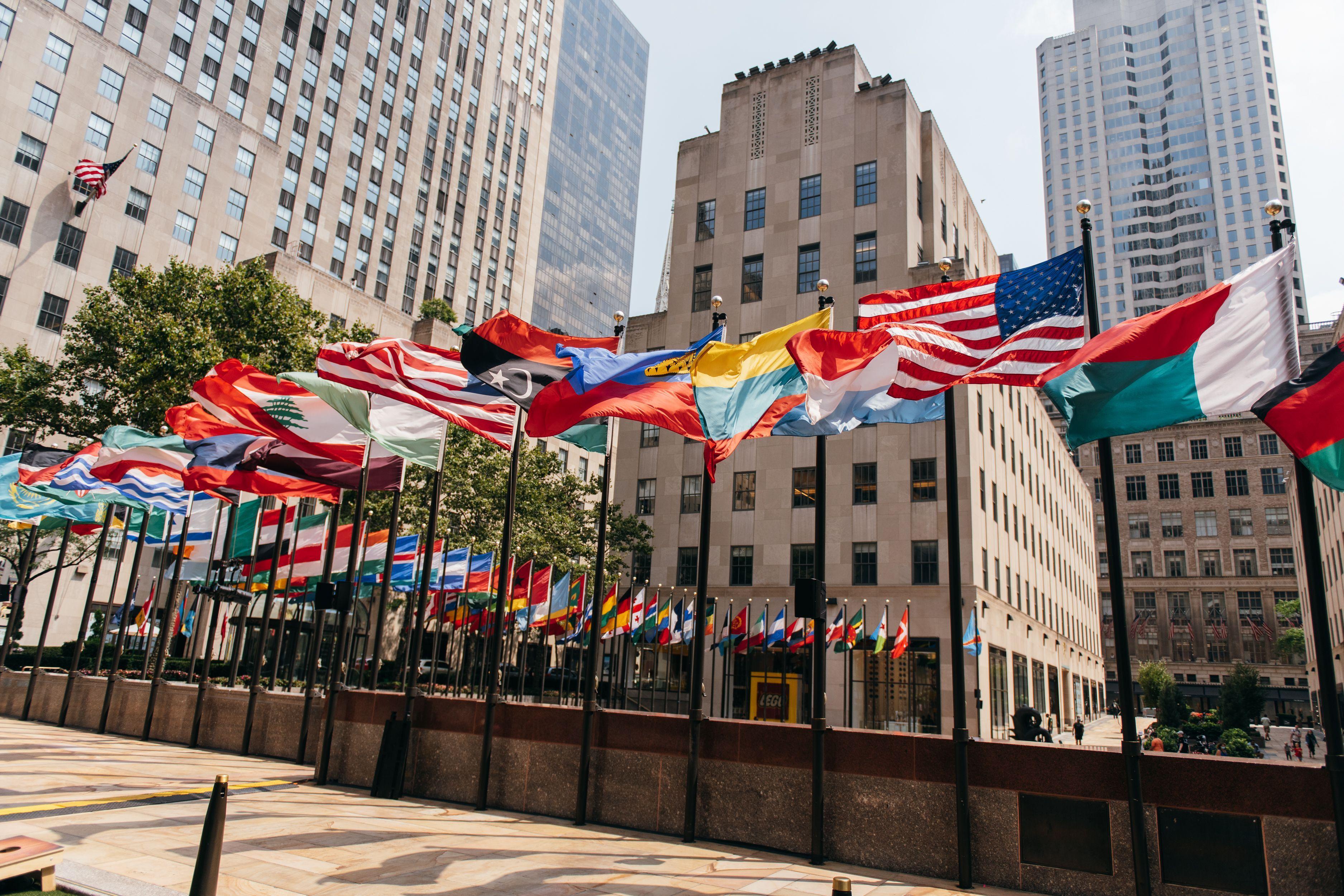 international flags flying at rockefeller center
