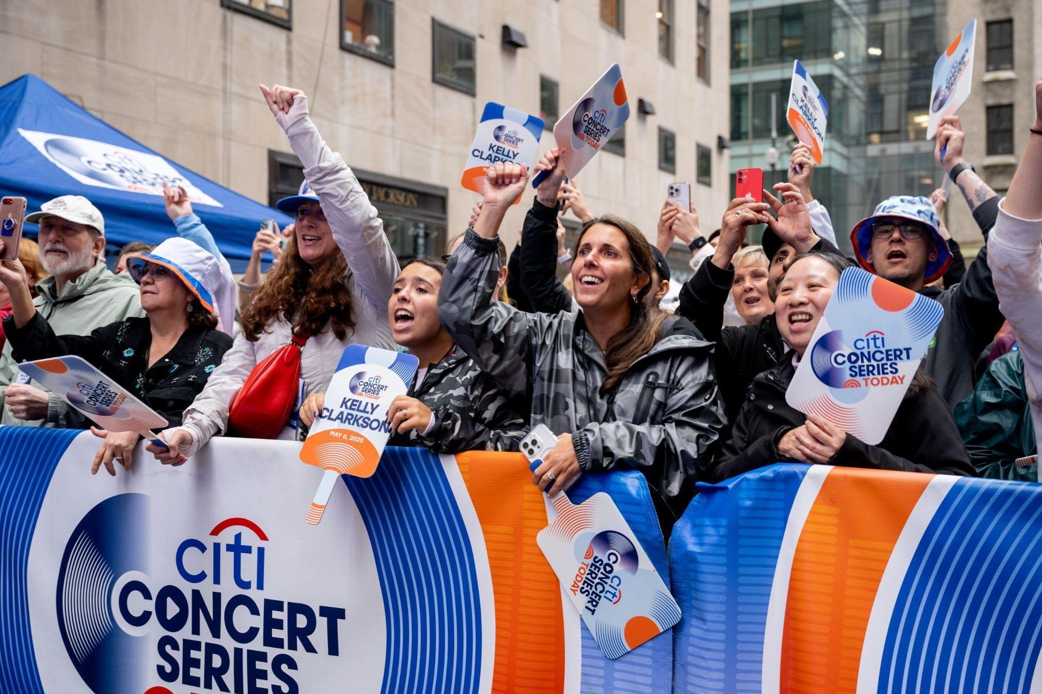 people standing outside Rockefeller Plaza