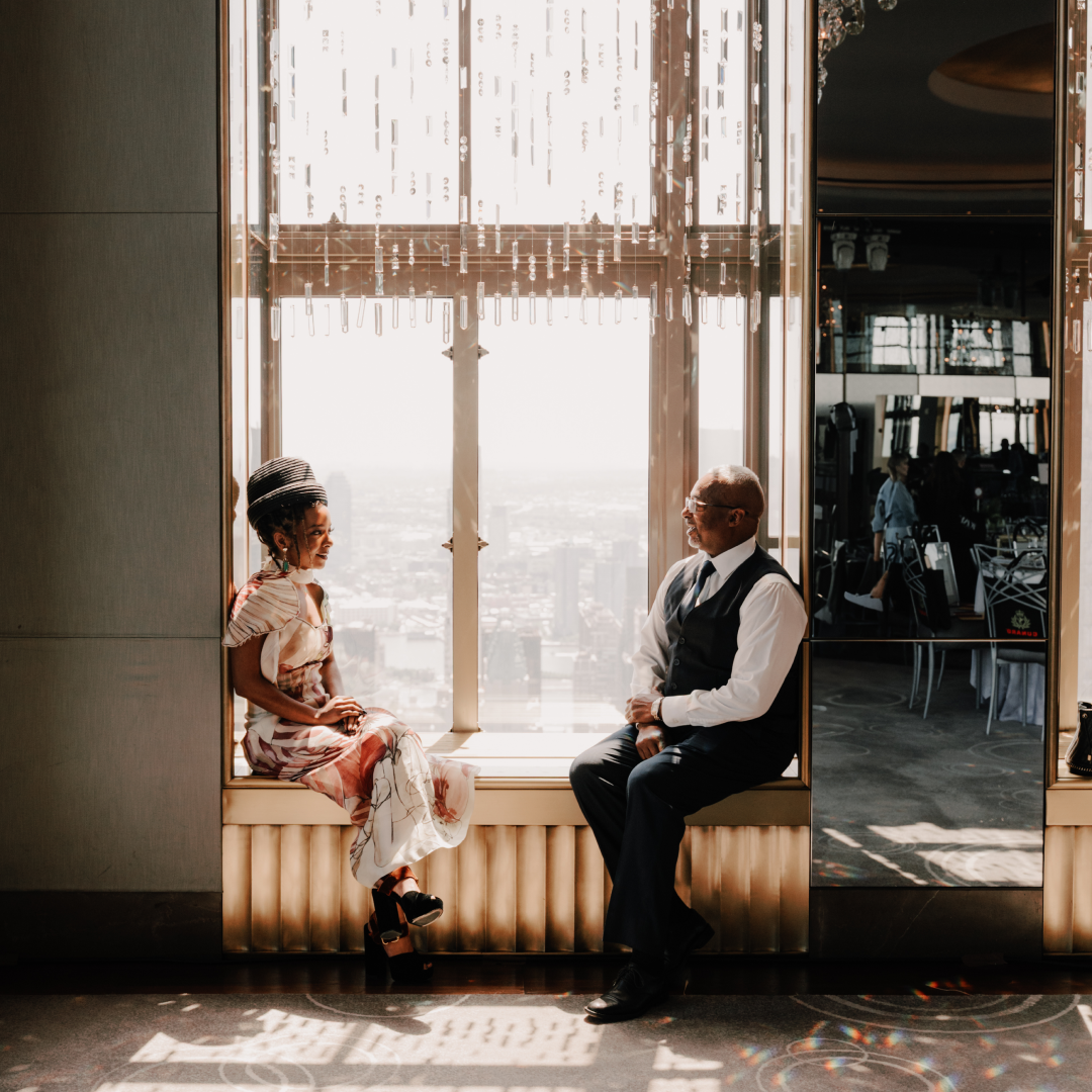 Actress Kara Young sits with her father, Klay Young, inside the Rainbow Room
