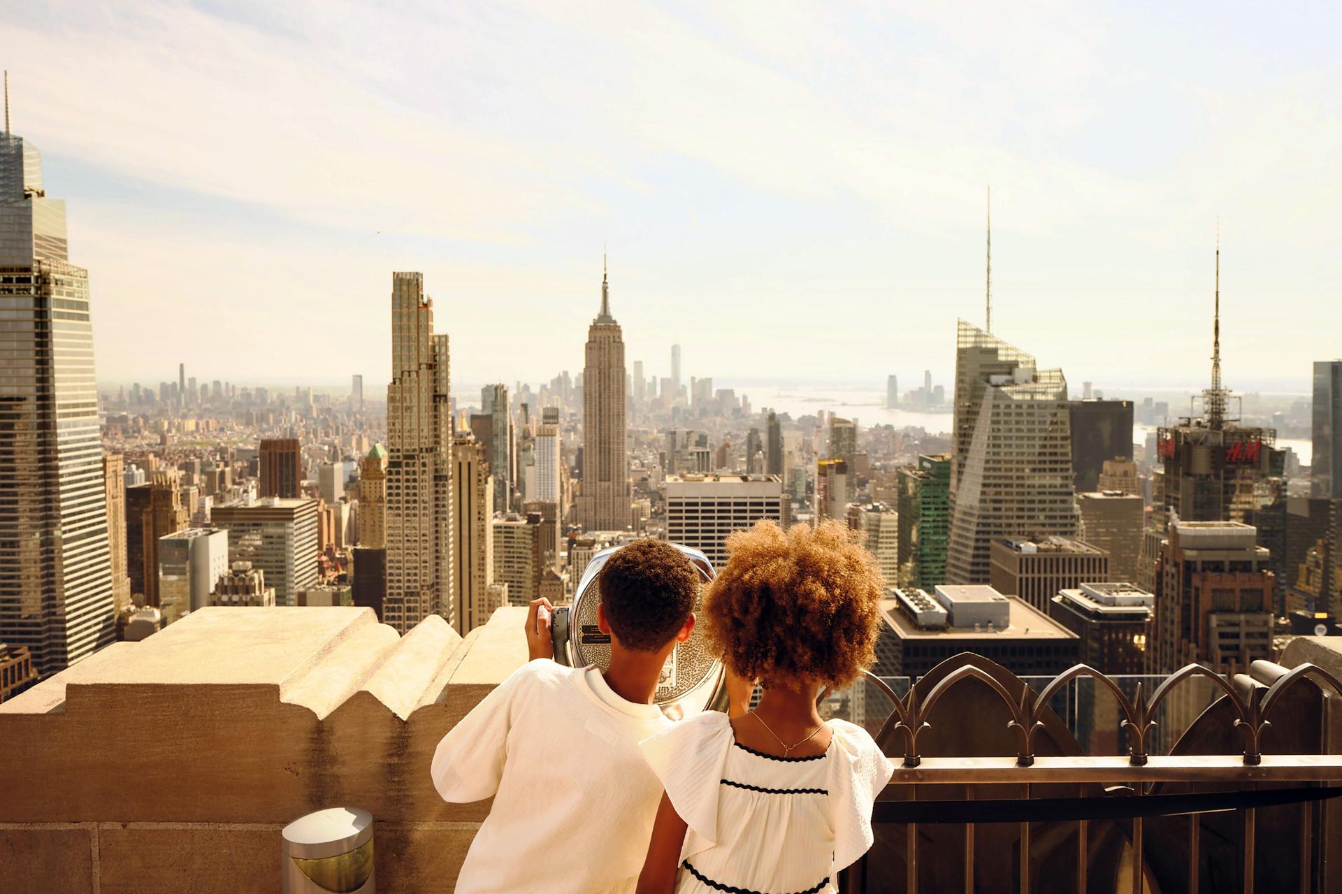 kids looking at the view from Top of the Rock
