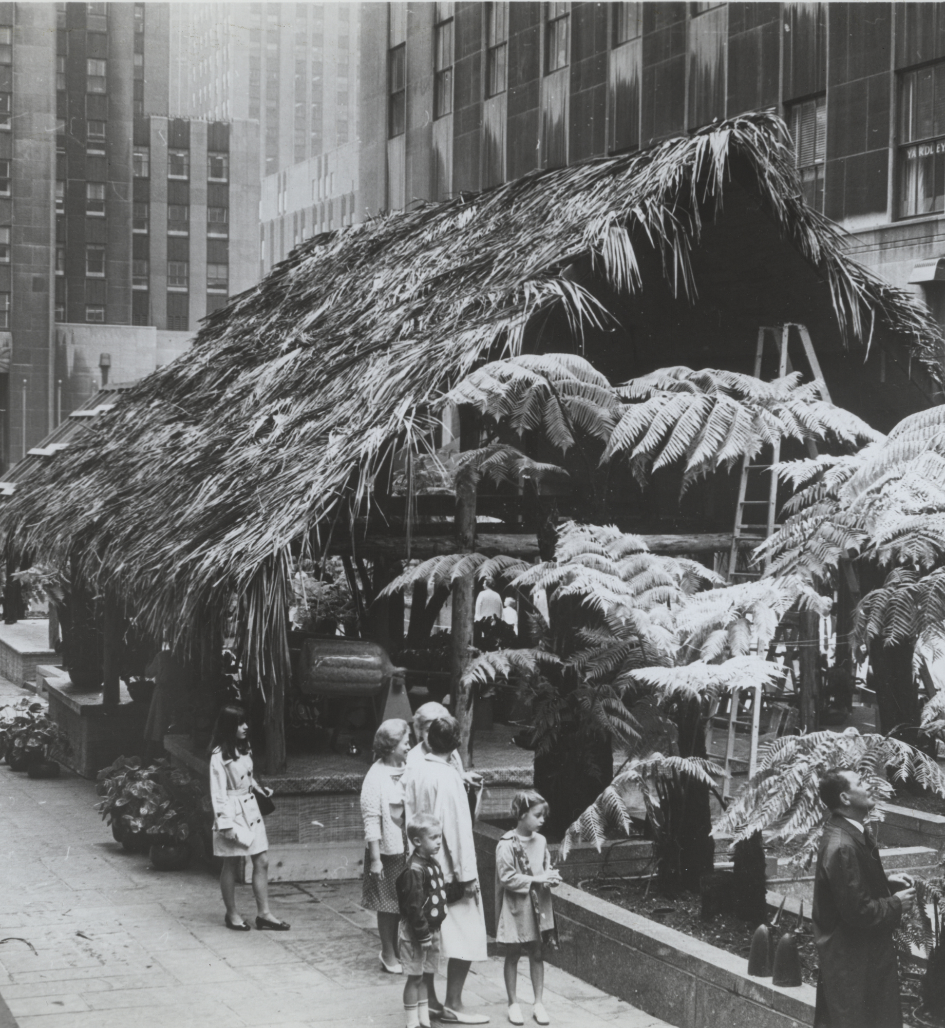 A Hawaiian Garden features hales, tikis, tree ferns, feather kahilis, and more in the Channel Gardens