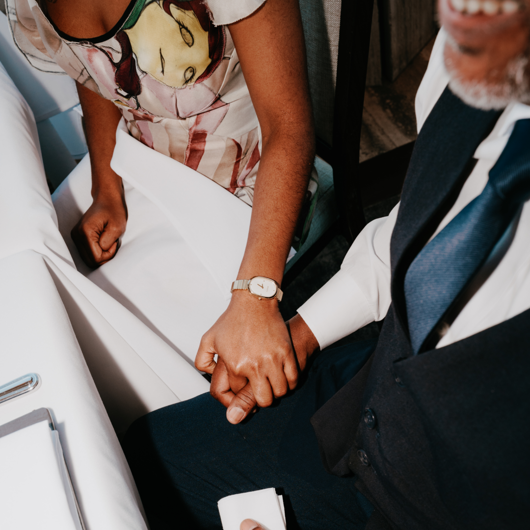 Actress Kara Young and her father Klay Young holding hands during an interview