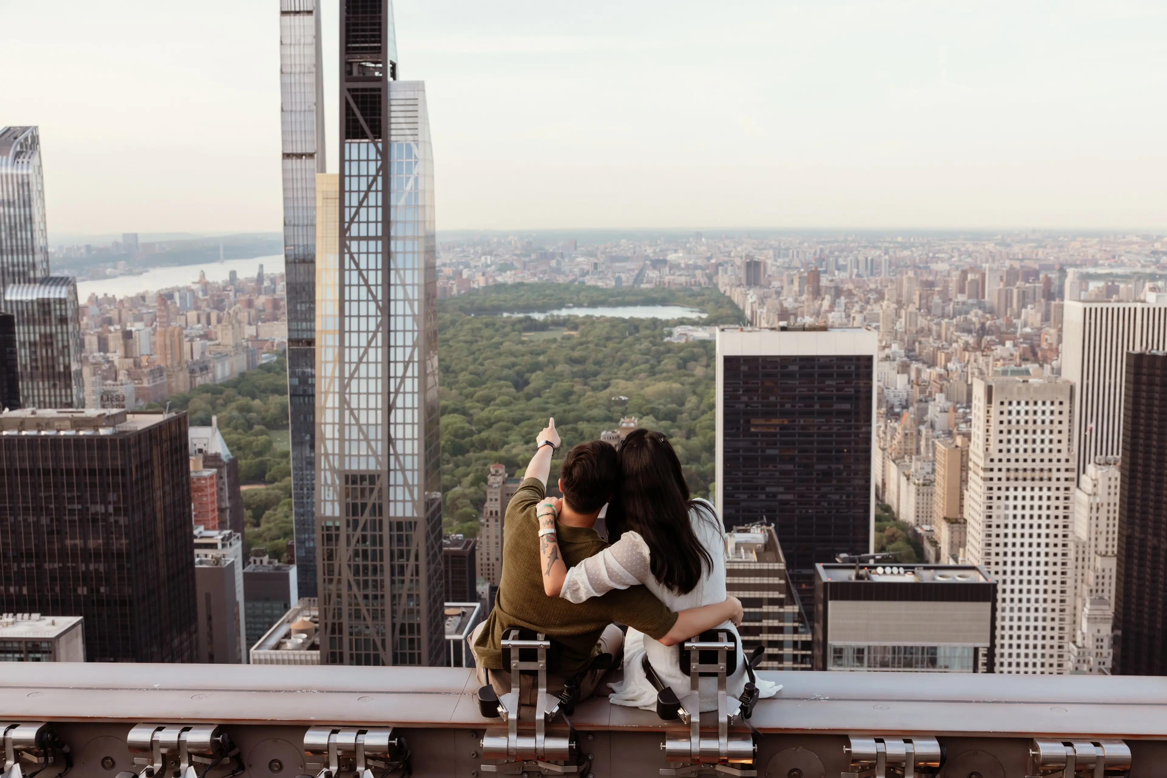 a couple on the beam experience at top of the rock