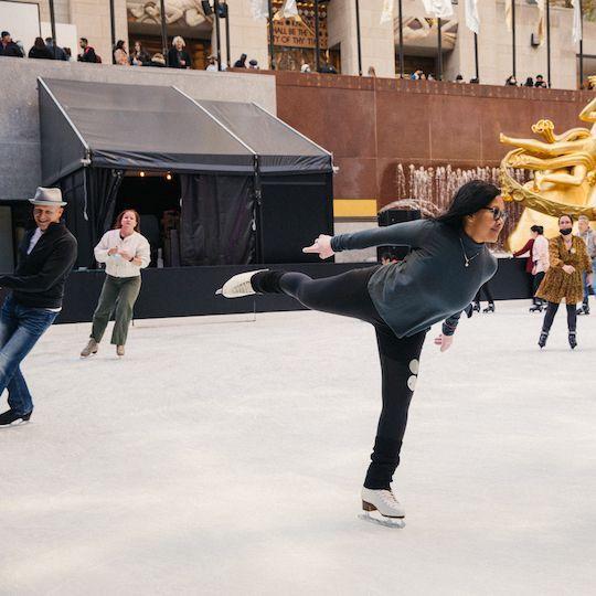 Woman ice skating on The Rink at Rockefeller Center