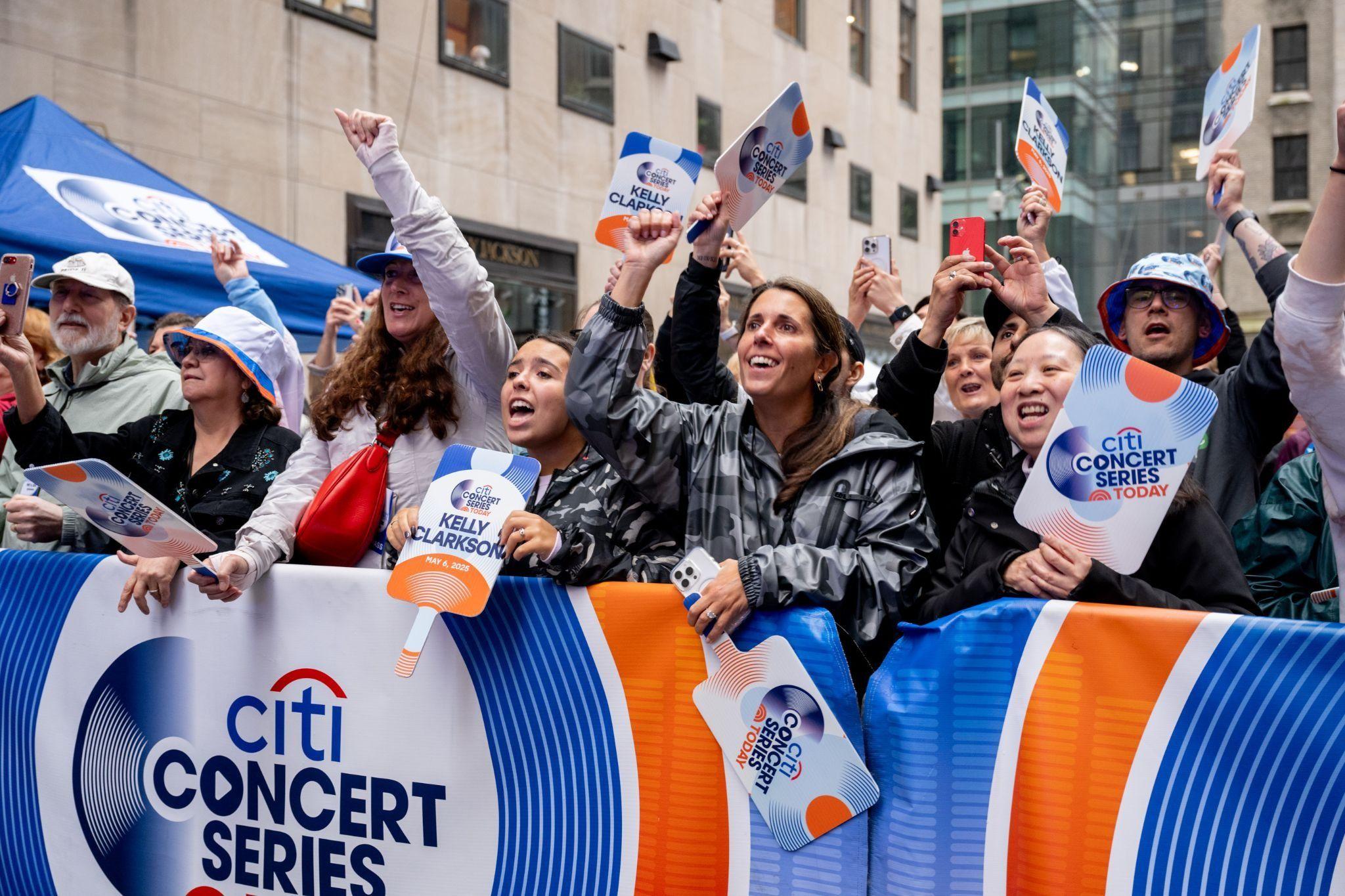 people standing outside Rockefeller Plaza